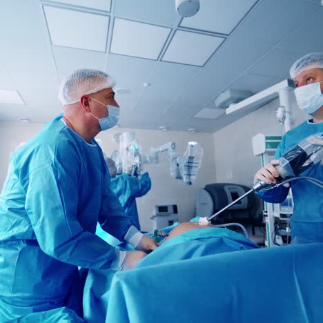 doctors use robot in surgical room in hospital. robotic arm of a modern medical equipment during the surgery in the contemporary operating room.