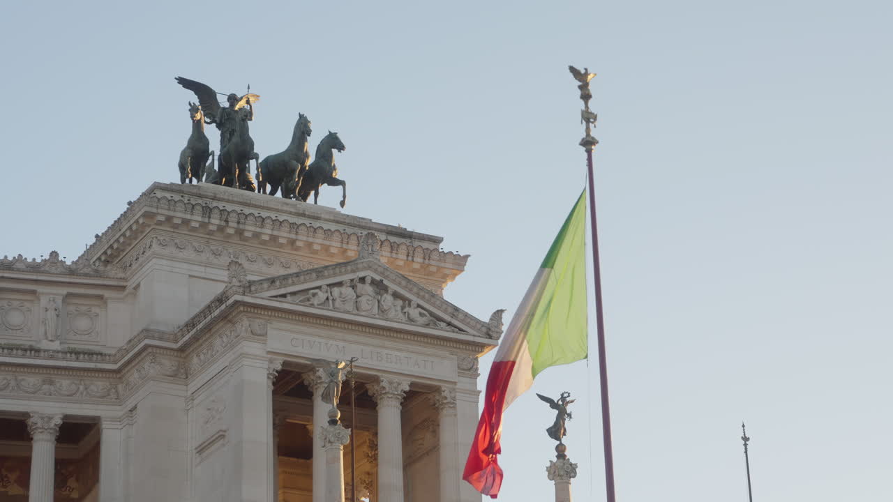 Italian flag and statues of Monument to Vittorio Emanuele II, Rome, Italy