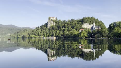 beautiful reflections on lake bled on an early sunny summer morning