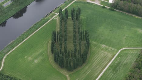 the green cathedral created by artist marinus boezem, this land art project was established in 1987 in the polder landscape near almere, aerial