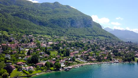 aerial view of a lakeside town in the french alps