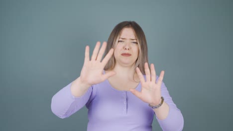 Fear-reaction-of-young-woman-looking-at-camera.-Coward-young-woman.