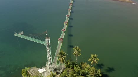 Top-down-fly-past-over-Bacuag-Hanging-Bridge-and-Octopus-Islet