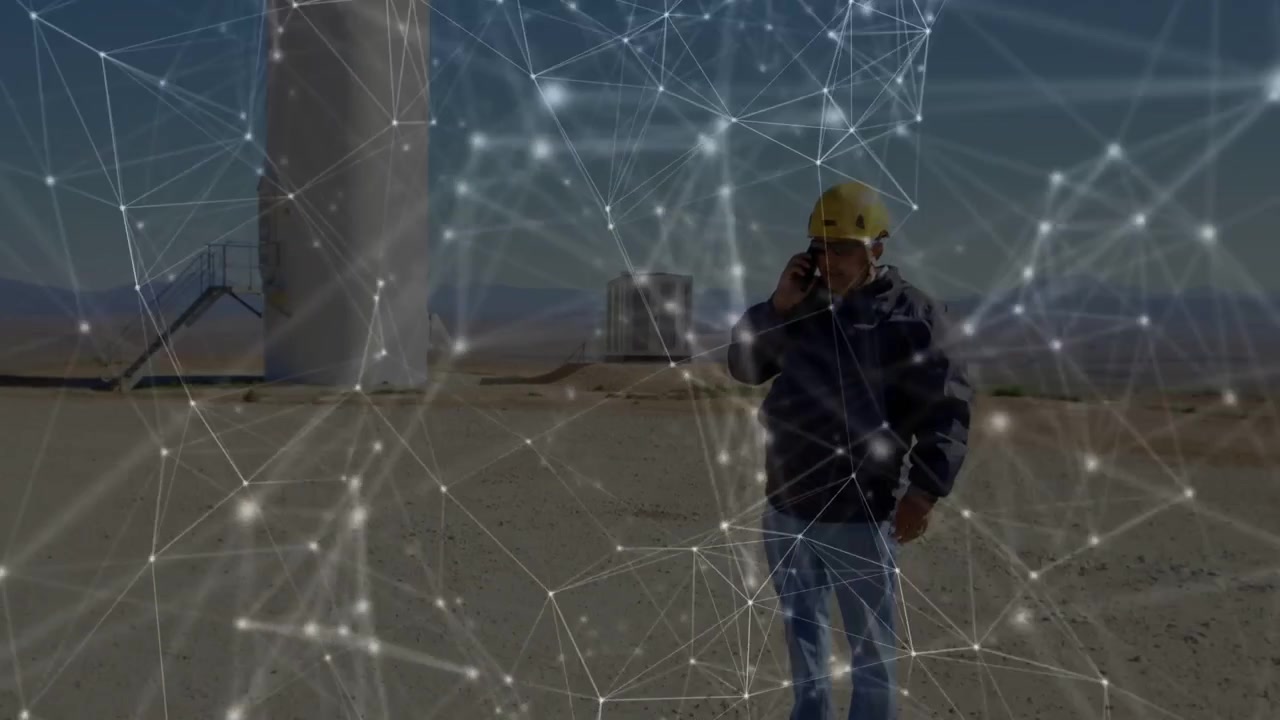 Vertical video: Taking call, hardhat tech approaching, talking on phone at wind farm overlay