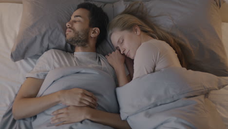 couple sleeping in bed