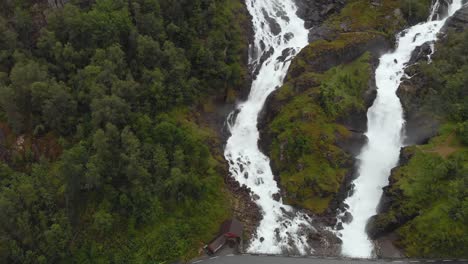 Latefossen-Waterfall-cascading-down-Norwegian-highland-mountain,-aerial-view