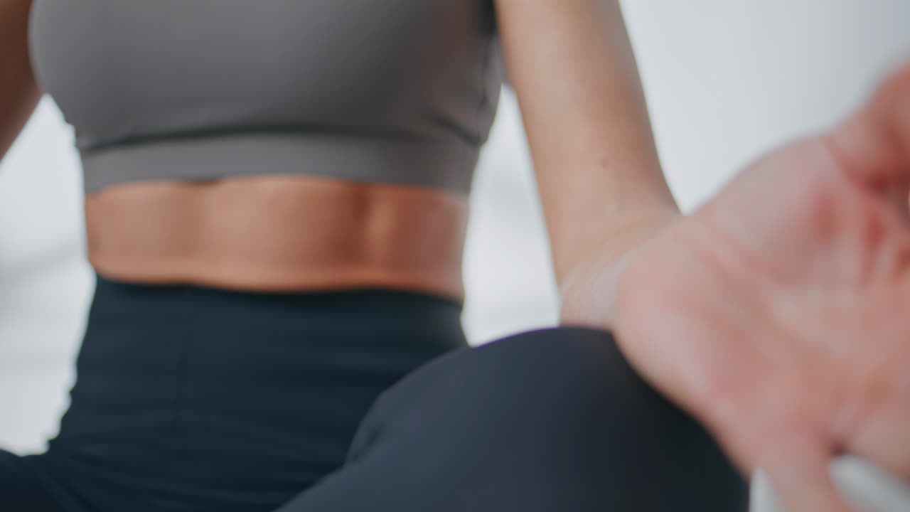 Closeup girl hands meditating in lotus position. Woman practicing mudra yoga