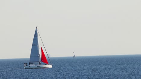 sailboat gliding across calm ocean waters