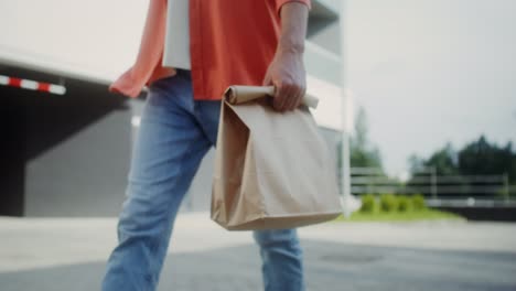 person carrying takeout