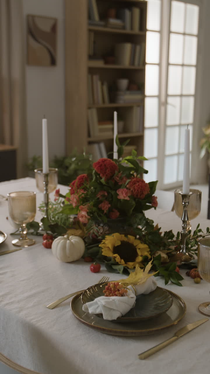 Elegant Fall Table Setting with Floral Centerpiece and Candles