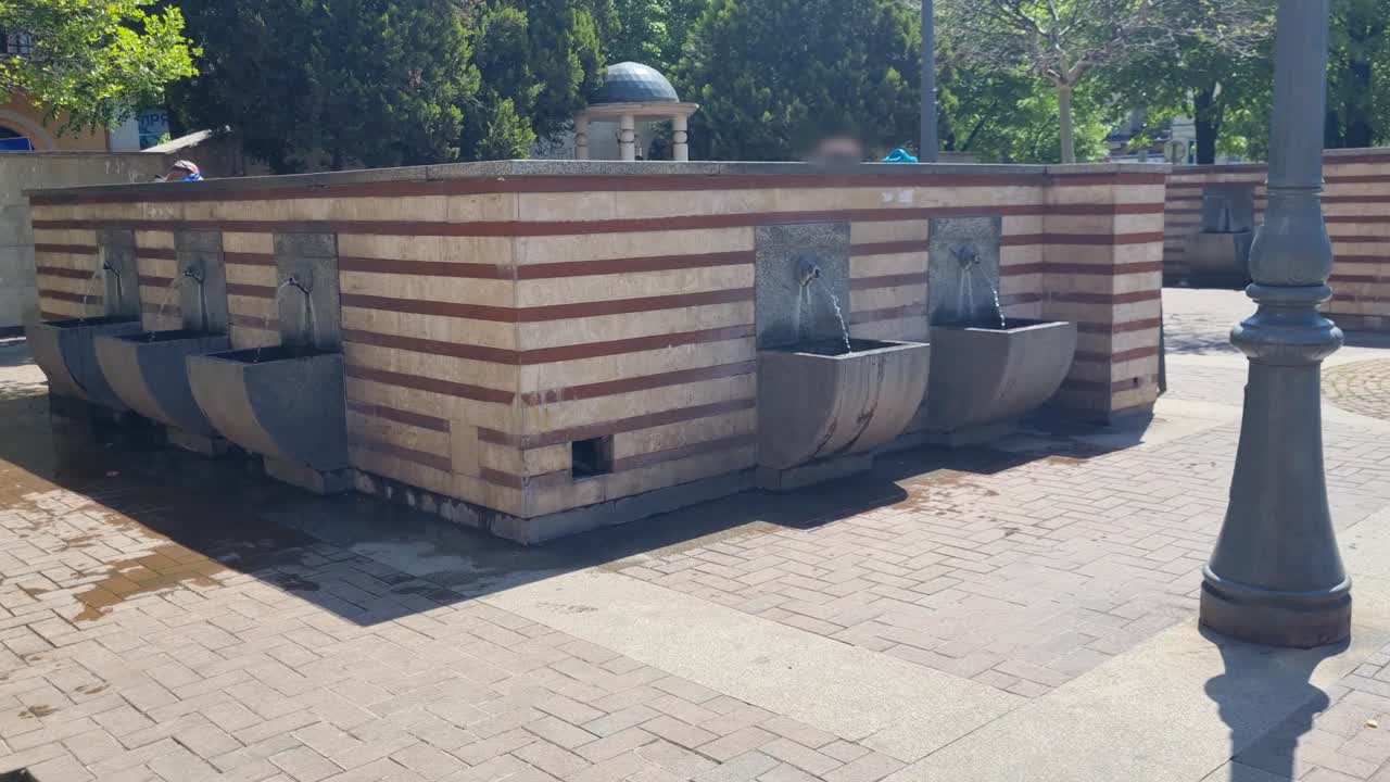 Shot of mineral water springs in Sofia’s Serdika district, Bulgaria, where locals come to fill bottles for health benefits from natural healing fountains in the city center