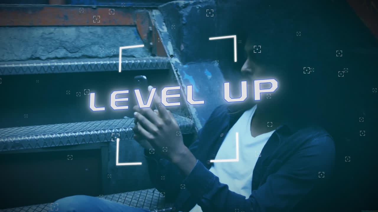 Animation of level up text and data processing over biracial man using smartphone