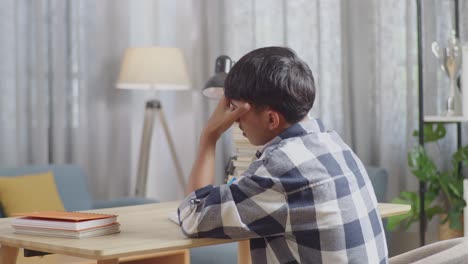 stressed young adult at desk