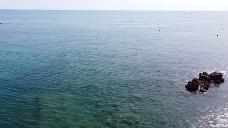 Zooming-out-aerial-view-of-Castiglioncello-coast-side-near-famous-Bagno-Salvadori