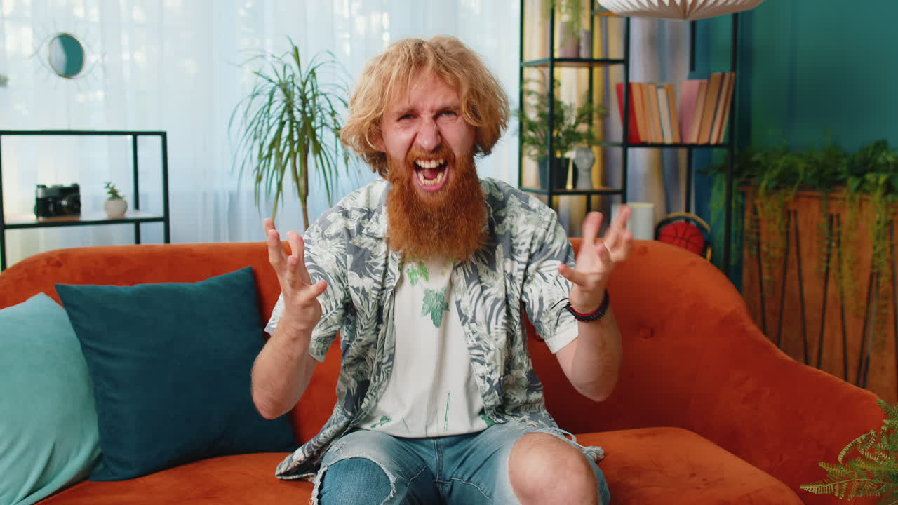 Aggressive man screams from stress tension problems panic hopelessness fear surprise shock nervous