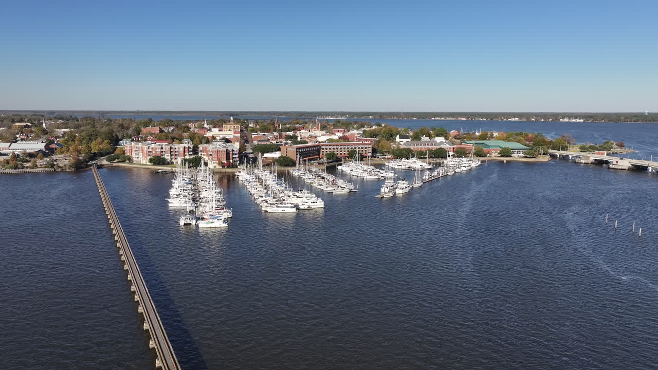 Drone shot the Downtown New Bern NC Waterfront area, with boats the marina, wide aerial shot