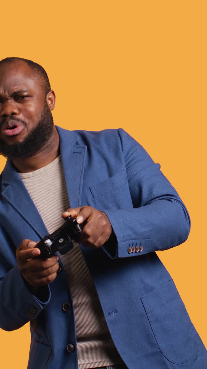 African American Man Playing Video Game and Showing Disappointment