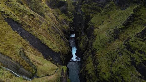 breathtaking river waterfall in fjaorargljufur canyon, iceland, aerial