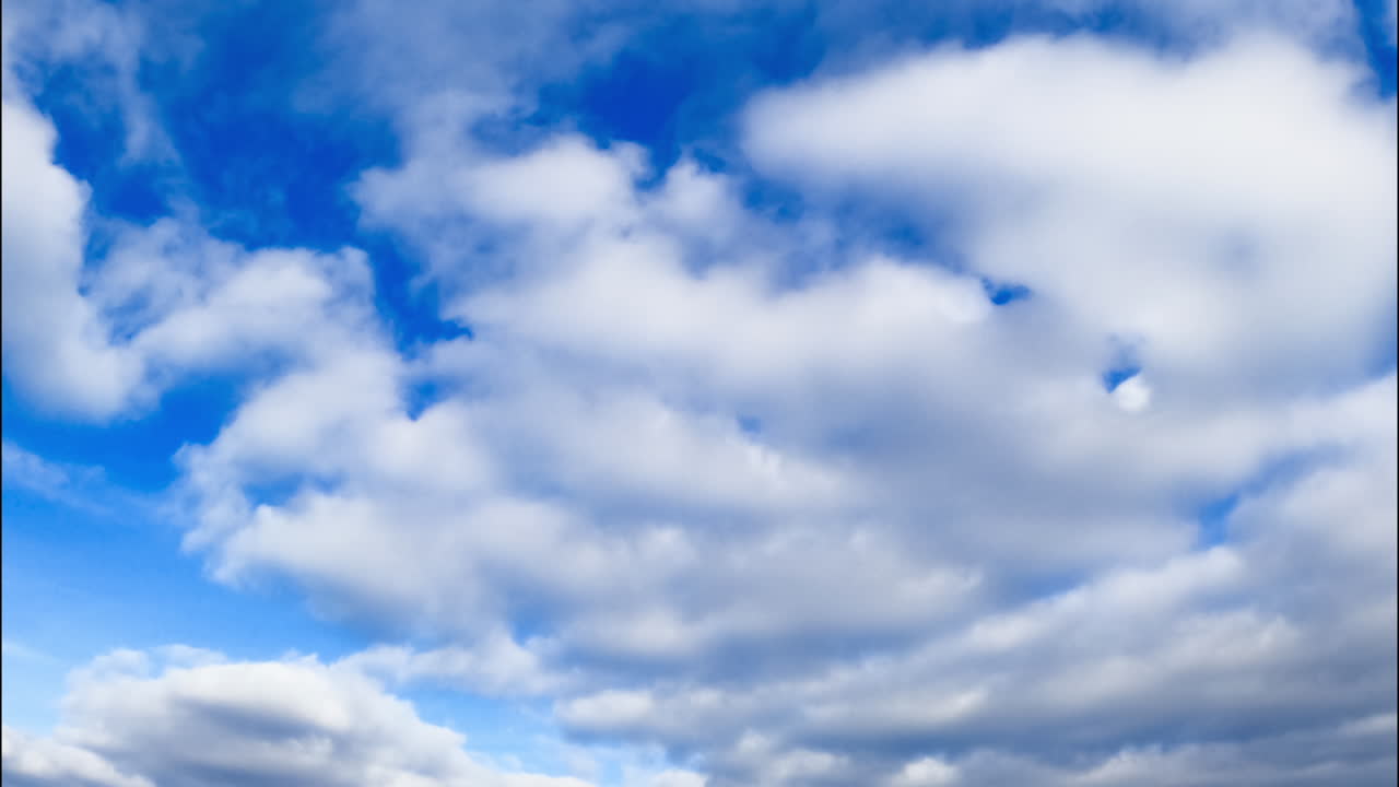 Clouds accumulating in the atmosphere. Low angle view on the rain cloudscape formation.