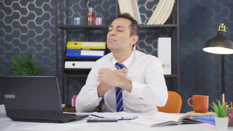 Depressed-and-constricted-businessman-loosening-his-tie.