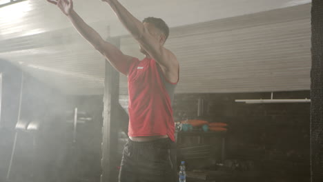 man exercising with a medicine ball in a gym