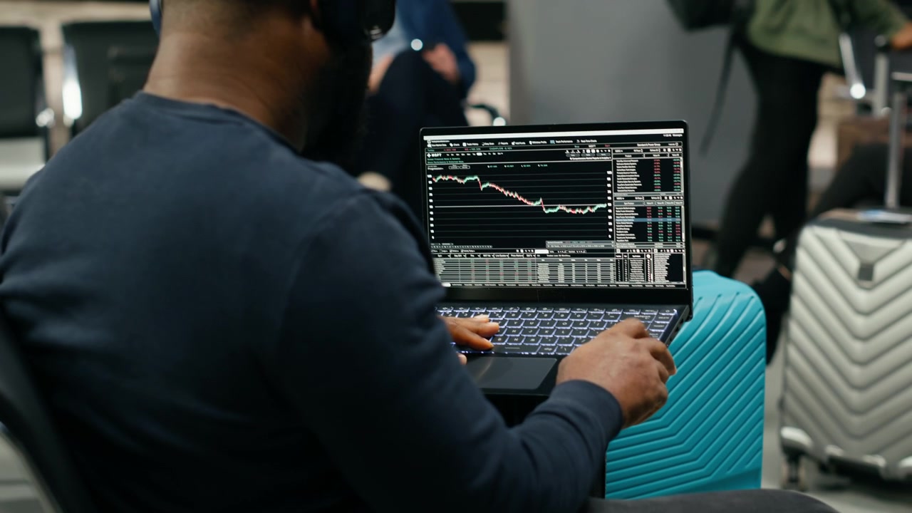 Black casual entrepreneur analyzing stock data trends and financial performance