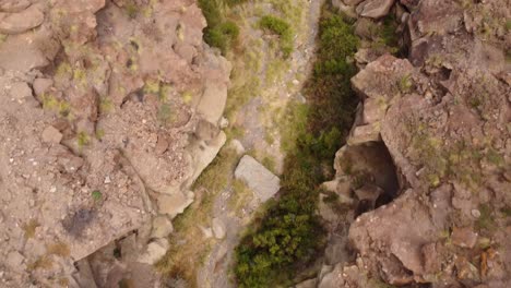 Sandstone-river-valley-on-dry-season,-aerial-top-down-view