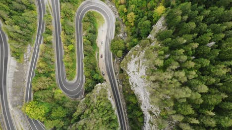 aerial drone of winding road in towering canyon of cheile bicazului in romania