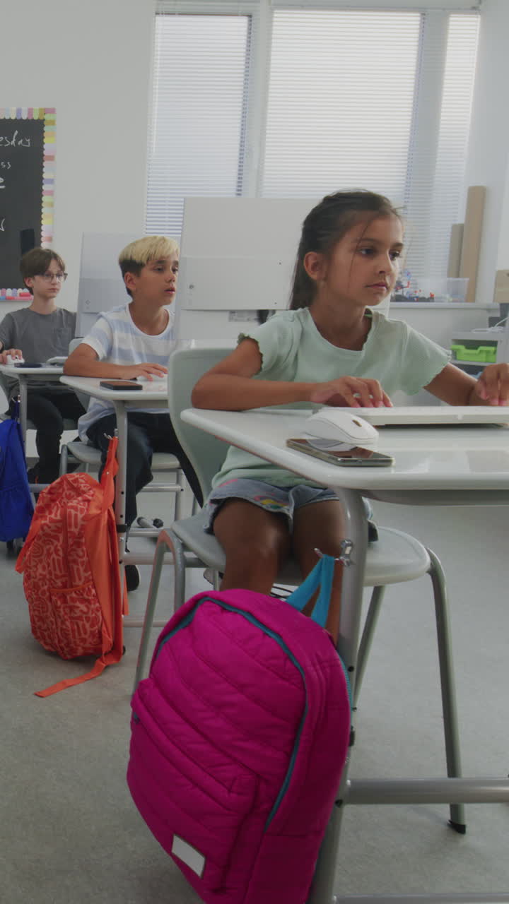 Primary School Students Working on Creative Projects on Computers Studying Programming