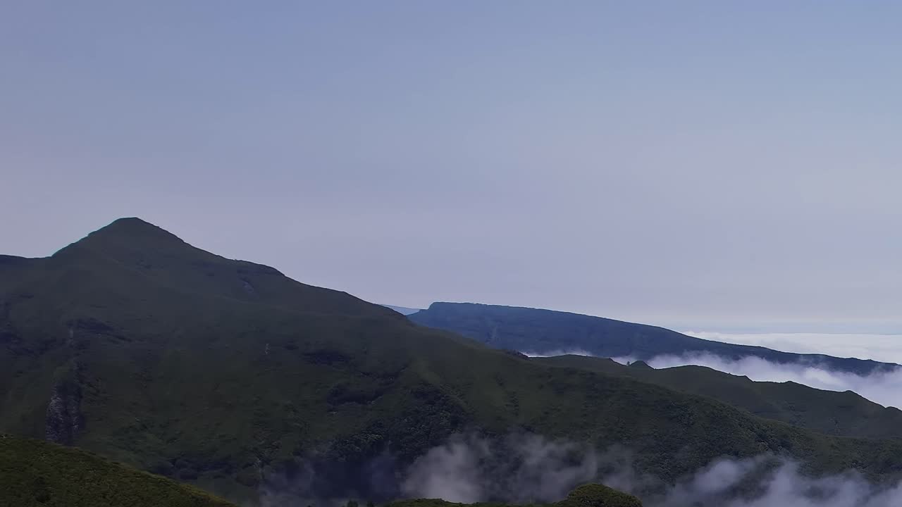 Stunning aerial view of Madeira's mountains and cloud cover