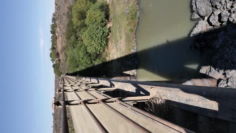 vertical orientation: old bridge crossing orange river, karoo rsa