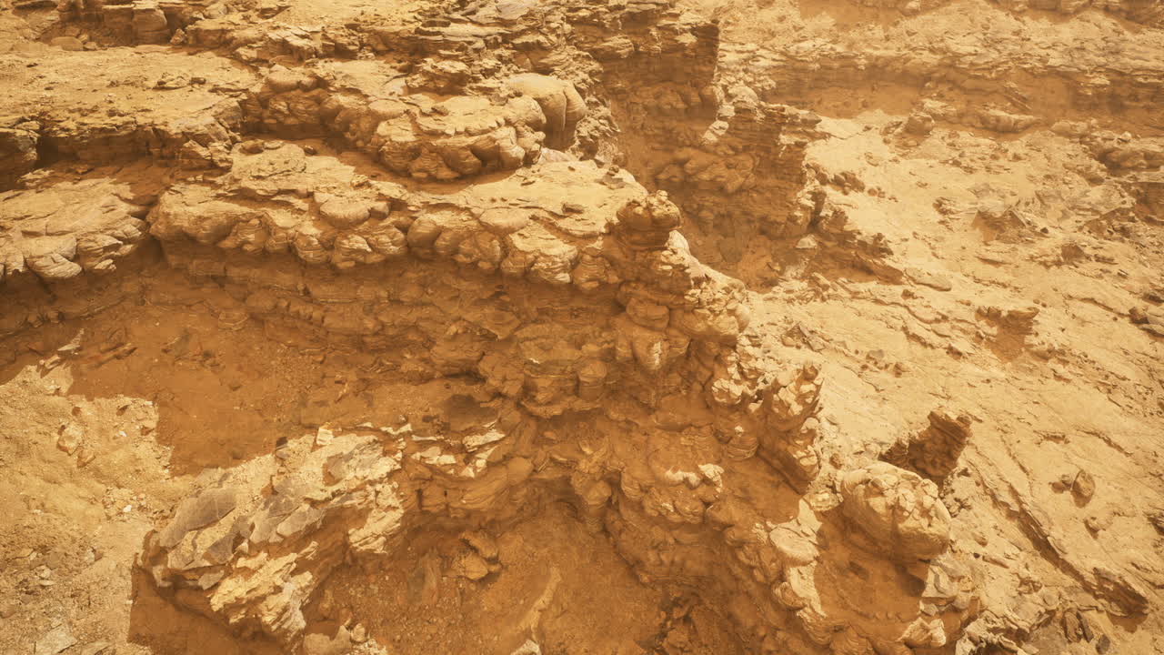 Stunning rock formations in a dusty landscape under bright sunlight