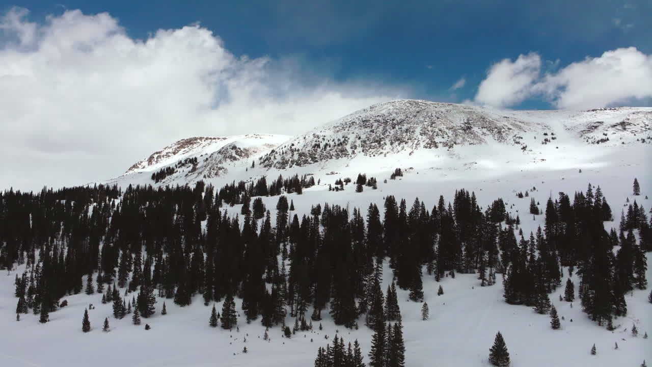 Deer Creek Montezuma Rocky Mountain Colorado backcountry powder spring slush fresh snow powder aerial cinematic drone partially cloudy weather Keystone Epic Vail Pass Ikon forward motion