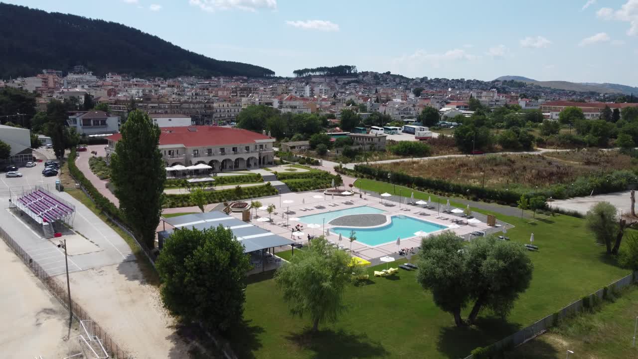 aerial Ioannina Greece, hotels, and the surrounding city in the summertime facing away from the lake