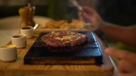 a chief cooks food on a grill, close up shot, insert sot