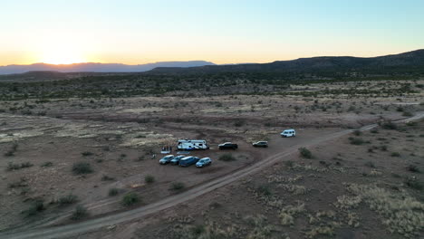 Camper-Van-And-Vehicles-Parked-In-Deserted-Landscape-Of-Sedona,-Arizona---Aerial-Drone-Shot