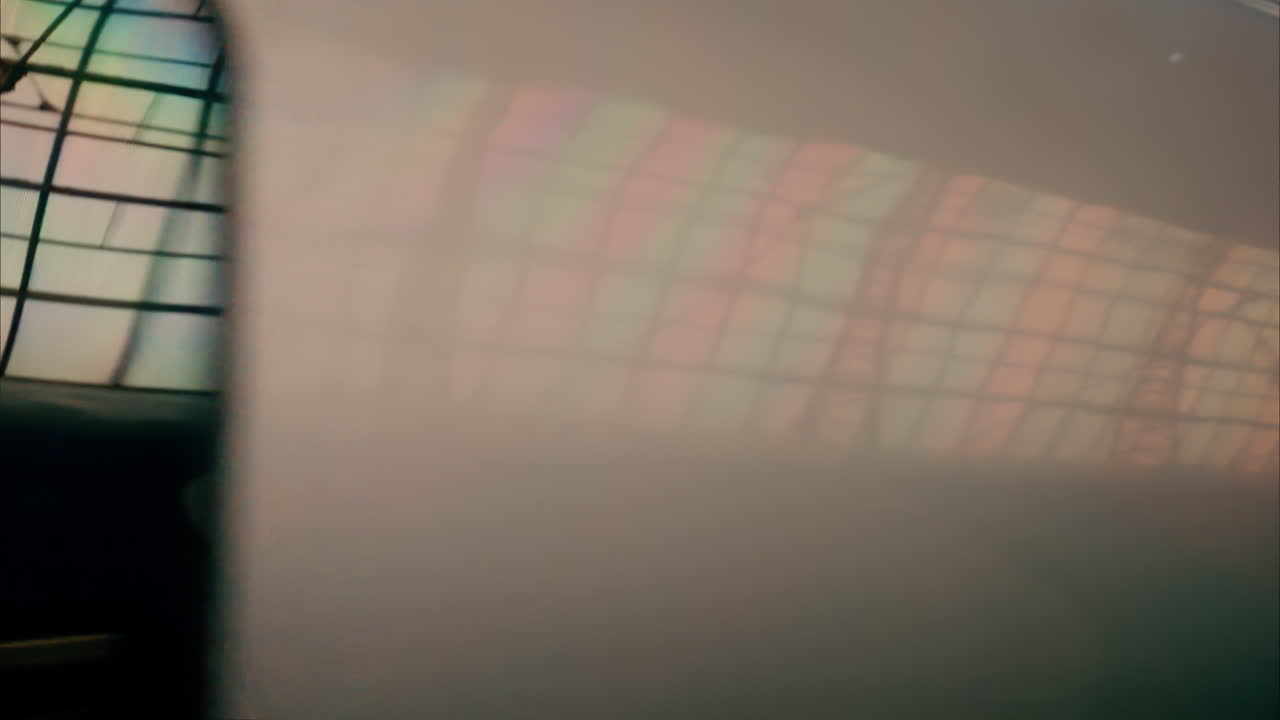 Close up view from a window of a train moving on the rails near a station in Nice, France