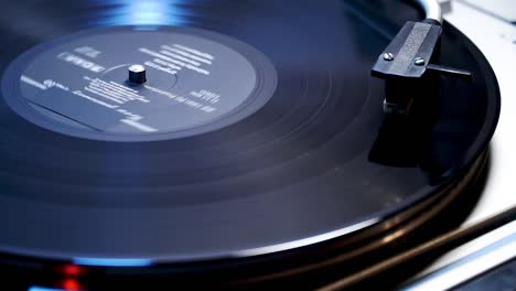 vinyl recorder playing in blue light