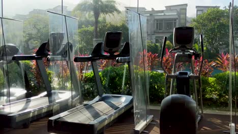 gym equipment at luxury private estate separated by pandemic covid 19 dividers