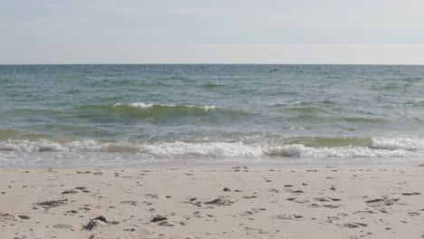 Jogging-woman-runs-along-beach