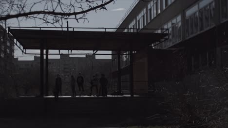 students gathering under a shelter