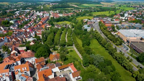 4k aerial drone video of greenspace along the frankische rezat river in ansbach, germany