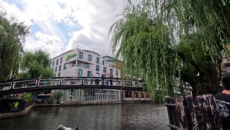 people and boats along camden town canal