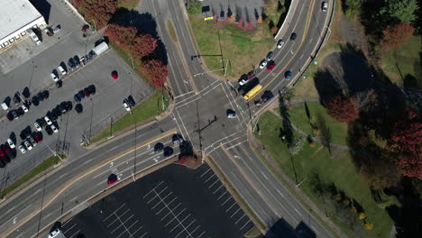 Top-Down-Aerial-View-of-Traffic-on-Street-Intersection-in-American-Suburbs-on-Sunny-Autumn-Day,-Bristol-Tennessee-USA,-High-Angle-Drone-Shot