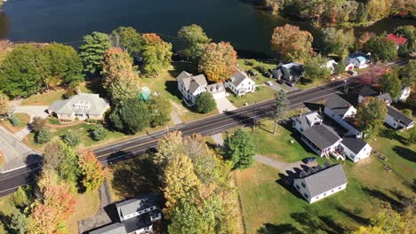 aerial view of sunny fall day by scenic lake in countryside of new england maine usa