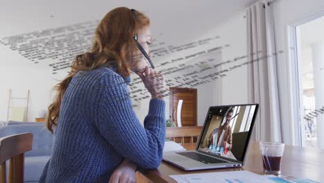 animation of data processing over caucasian woman working from home, having video call