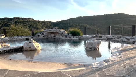 luxury pool on the hillside of hill country texas at an expensive home.