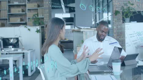 Data processing on interface over diverse colleagues discussing at casual office meeting