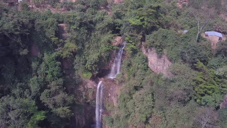 retreating aerial of stunning manchewe waterfall in malawi africa