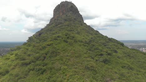 aerial shot rising up on a large african mountain in rural uganda